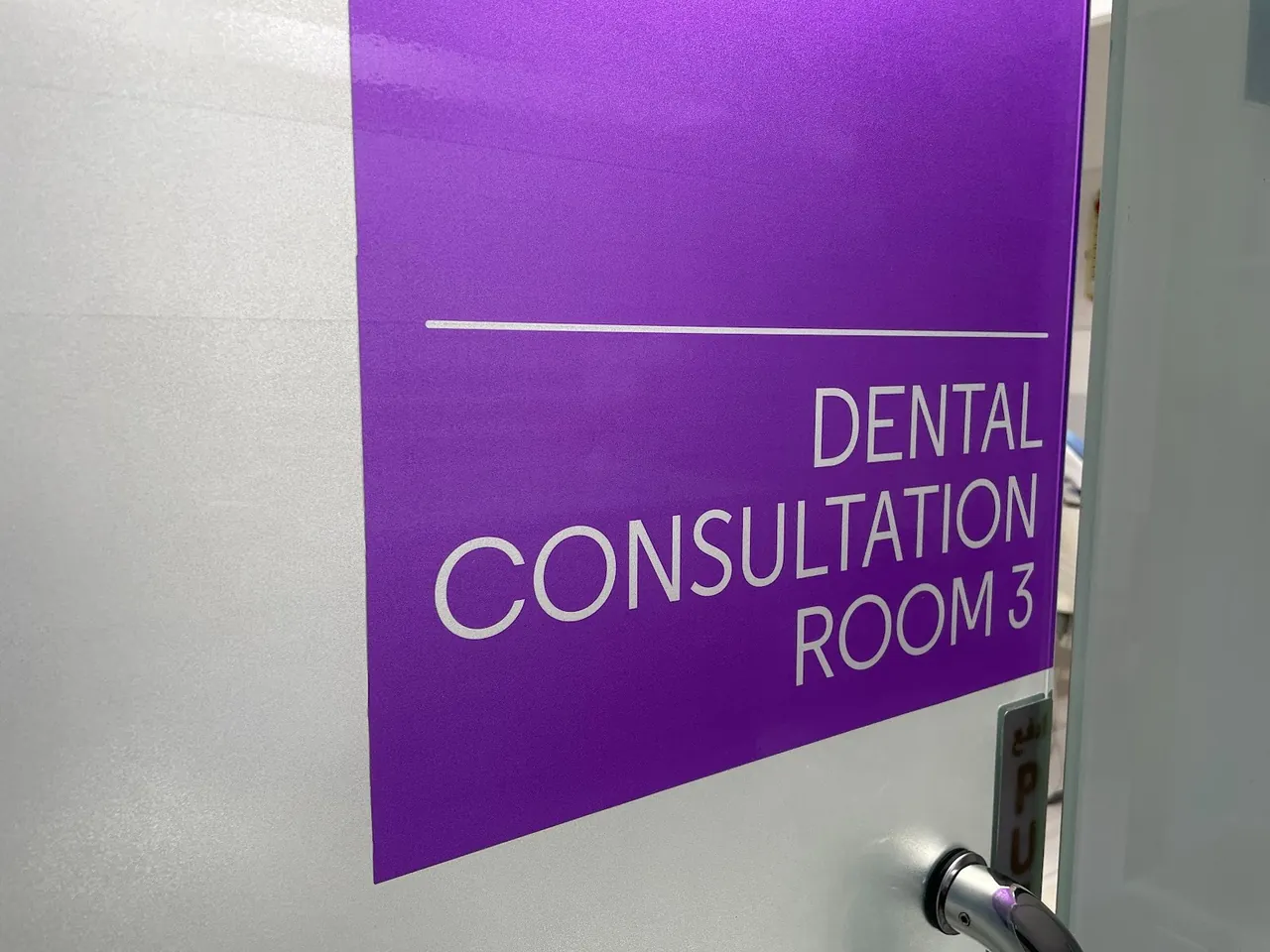 Door sign reading Dental Consultation Room 3